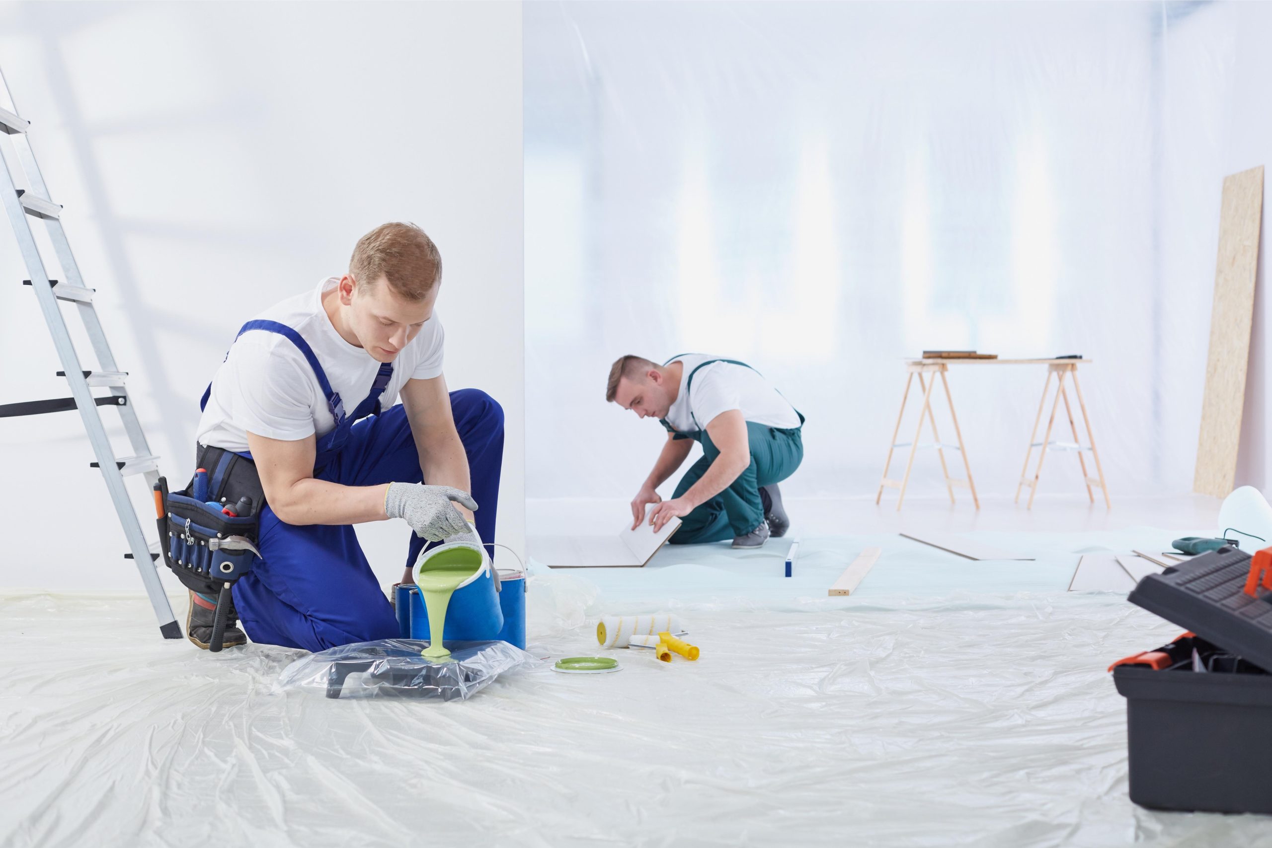 two-men-painting-wall-room
