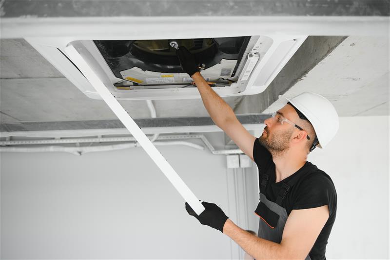 young-male-electrician-repair-conditioner